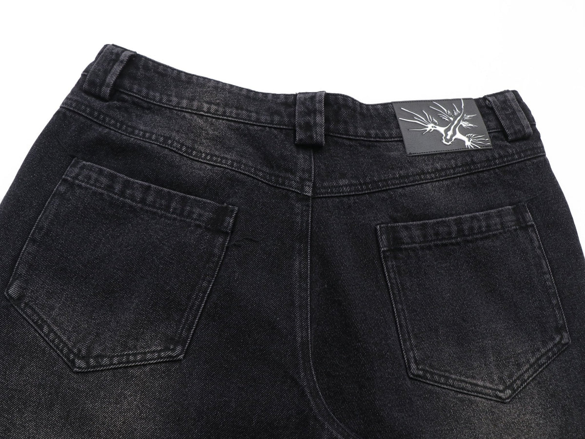 Sunfaded black heavyweight baggy denim with chrome leather back patch by WOJO