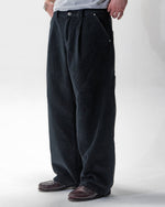 Black corduroy trousers with front pleats and a relaxed fit by WOJO
