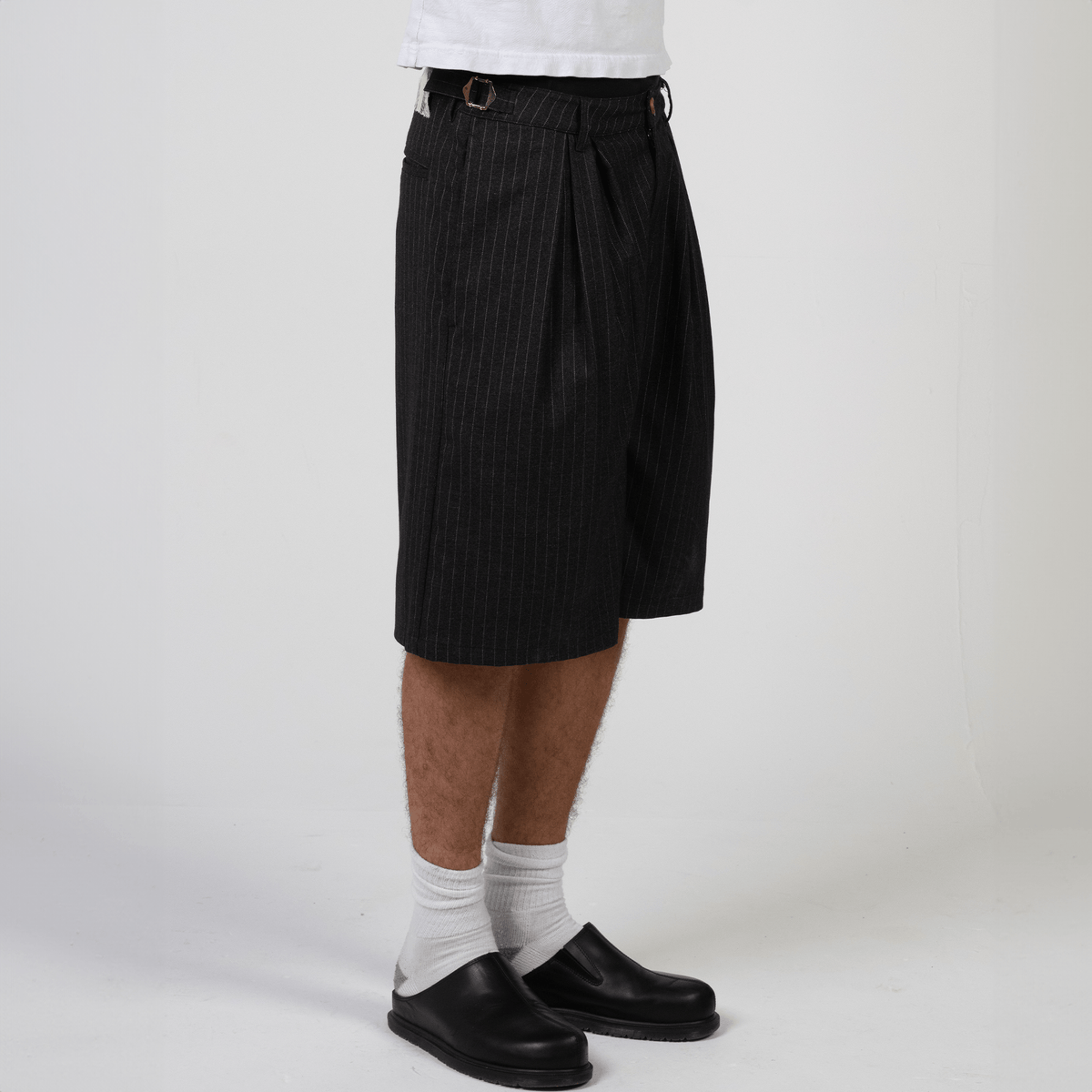 Black pinstripe wide-leg shorts in heavyweight rayon twill by WOJO