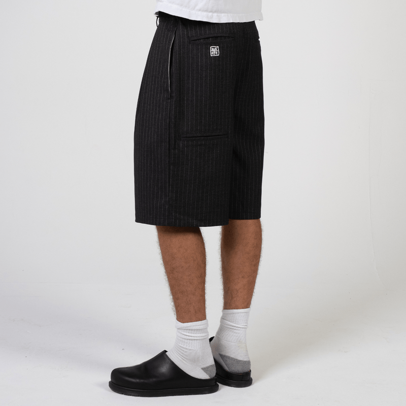 Black pinstripe wide-leg shorts in heavyweight rayon twill by WOJO