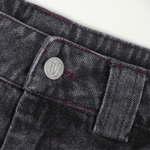 Stone-washed denim jorts with wine red stitching and chrome leather patch by WOJO