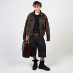 Stone-washed denim jorts with wine red stitching and chrome leather patch by WOJO