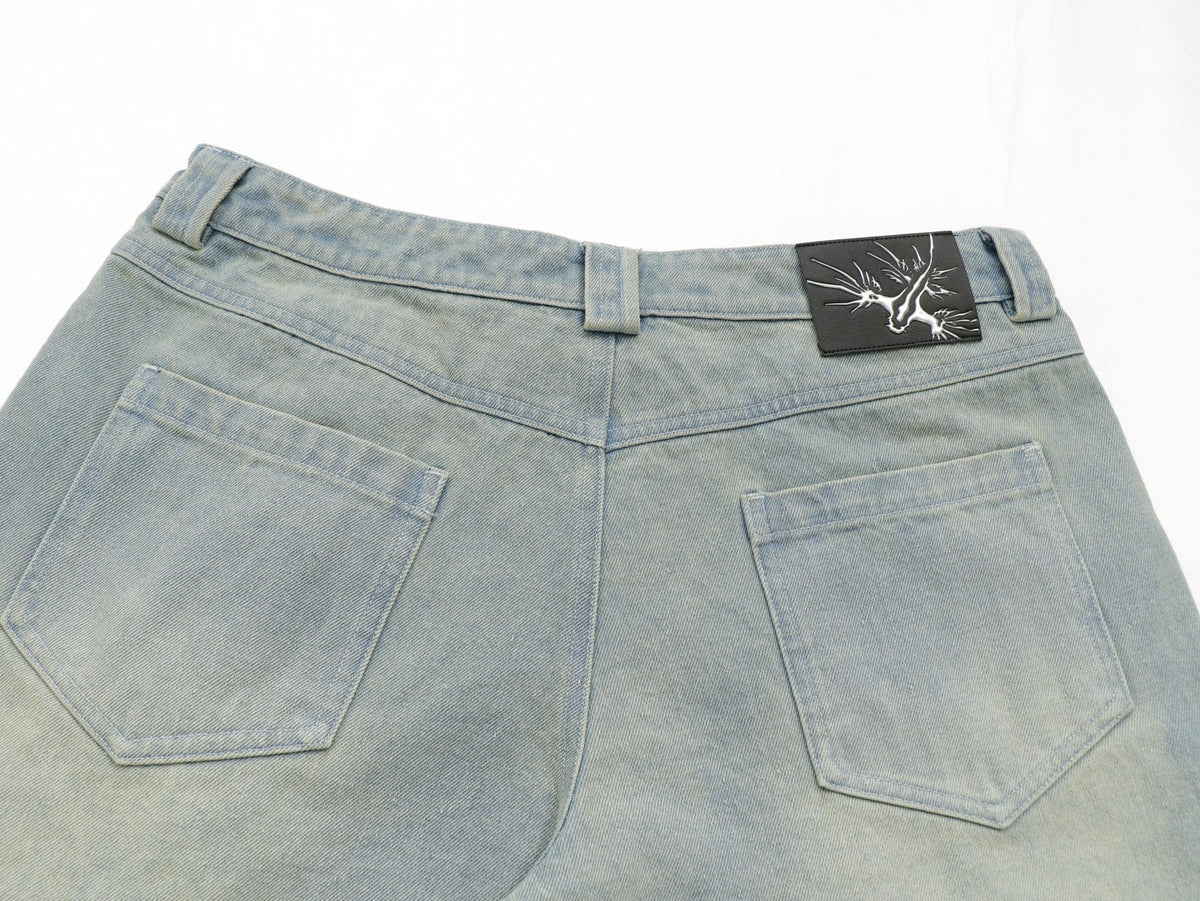 Sunfaded ice blue heavyweight baggy denim with chrome leather back patch by WOJO