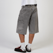 Silver heavyweight denim jorts with chrome leather patch by WOJO
