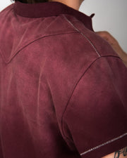 Sunfaded wine red cotton pique polo with single-stitch details by WOJO